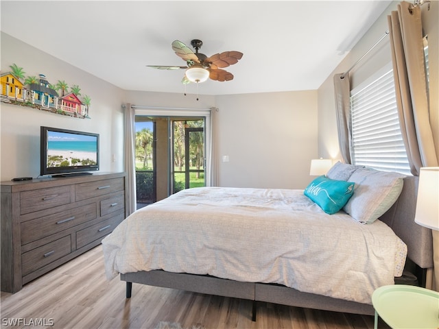 bedroom with access to outside, light wood-type flooring, and ceiling fan