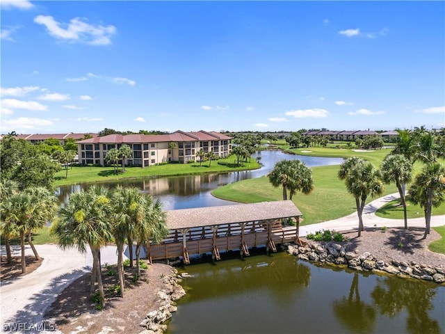 exterior space featuring a water view and a lawn