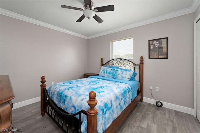 bedroom featuring ceiling fan, crown molding, and hardwood / wood-style flooring