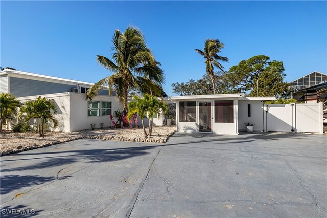 view of front of property featuring a sunroom