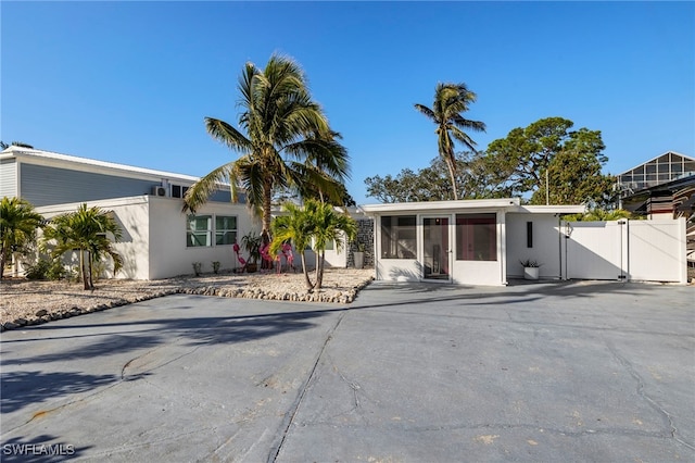 view of front of property featuring a sunroom