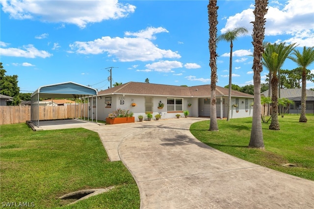 ranch-style house featuring a carport and a front lawn