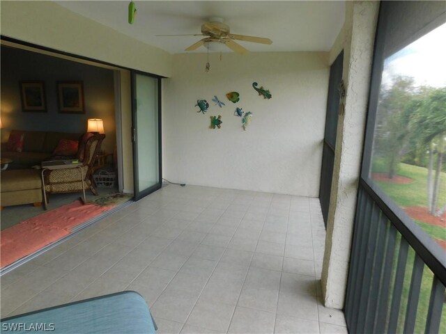 sunroom / solarium with ceiling fan