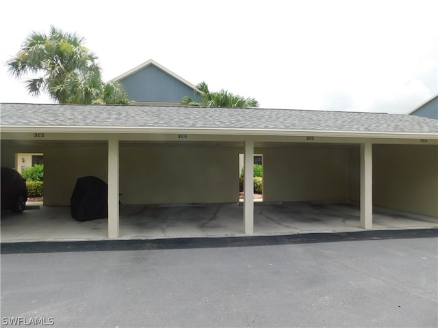 view of vehicle parking with a carport