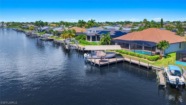 view of dock with a lanai, a water view, and a swimming pool