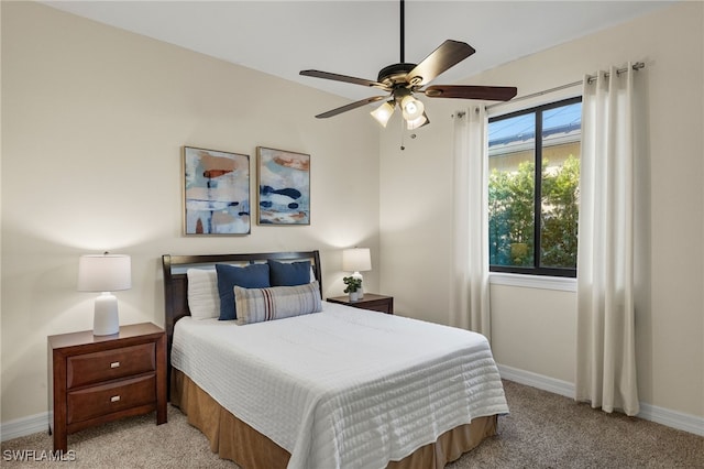 bedroom with light carpet and ceiling fan