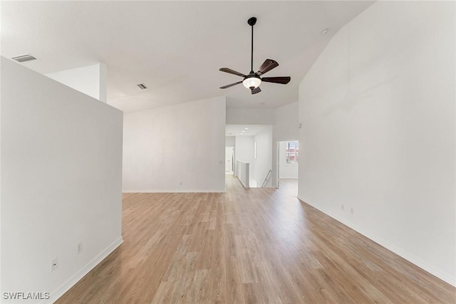unfurnished room with light wood-type flooring, baseboards, visible vents, and a ceiling fan