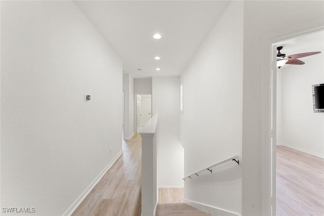 stairway featuring recessed lighting, ceiling fan, baseboards, and wood finished floors