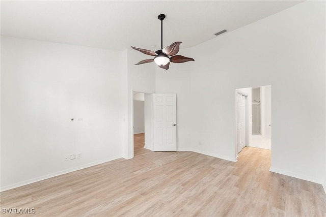unfurnished room with visible vents, baseboards, light wood-style floors, and a ceiling fan
