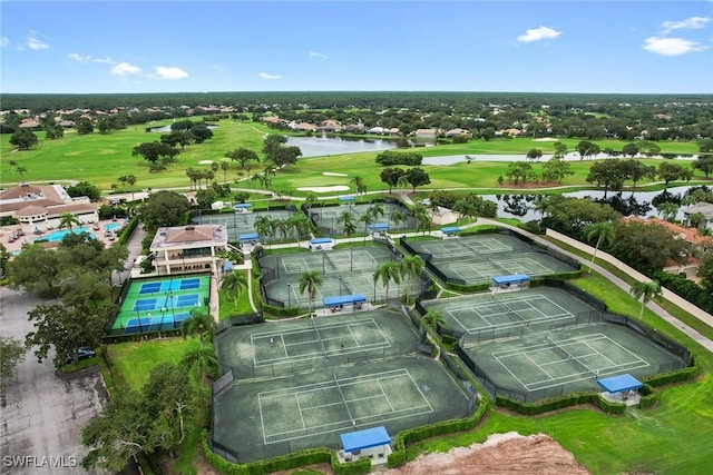 aerial view featuring golf course view and a water view
