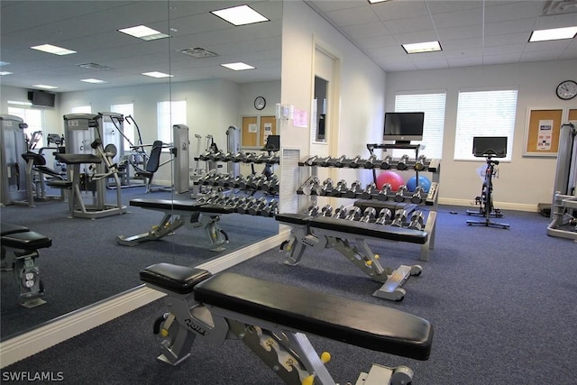 exercise room featuring a drop ceiling