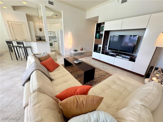 tiled living room with ornamental molding