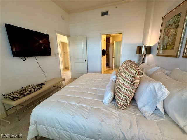 bedroom featuring high vaulted ceiling