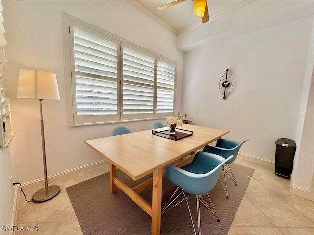 dining area featuring ceiling fan, crown molding, and light tile patterned flooring