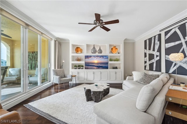 living room with built in shelves, ornamental molding, dark hardwood / wood-style floors, and ceiling fan