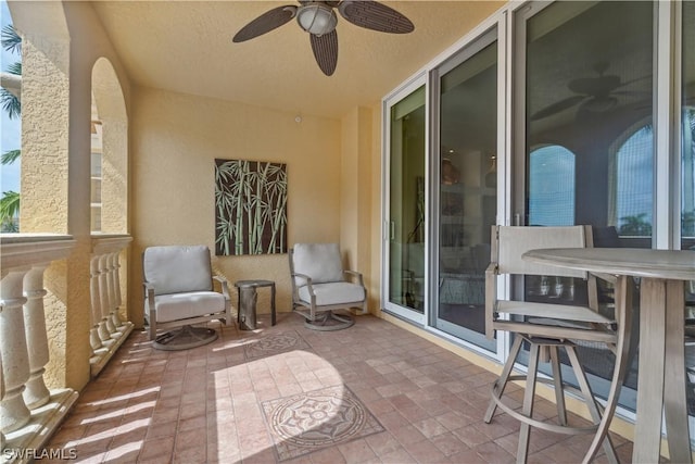 view of patio featuring ceiling fan