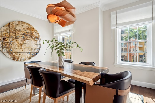 dining room featuring ornamental molding and hardwood / wood-style floors