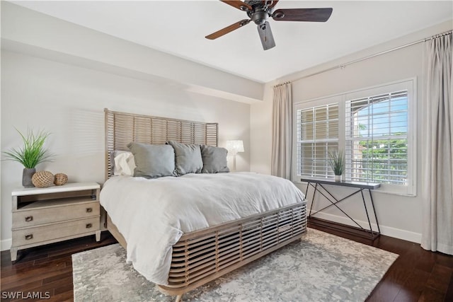 bedroom with dark wood-type flooring and ceiling fan