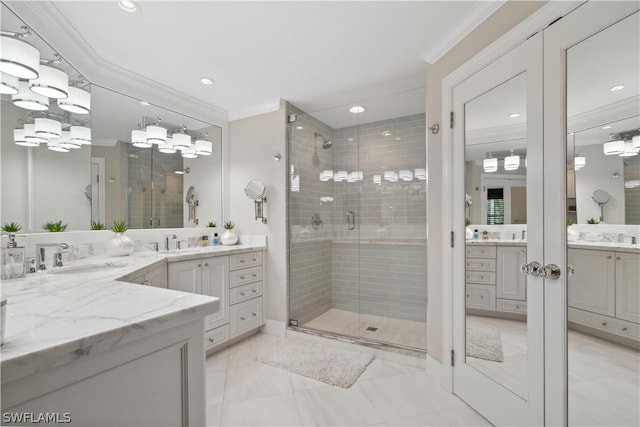 bathroom featuring crown molding, vanity, and walk in shower