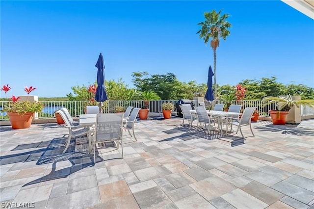 view of patio with a water view