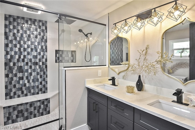 bathroom featuring dual vanity and walk in shower