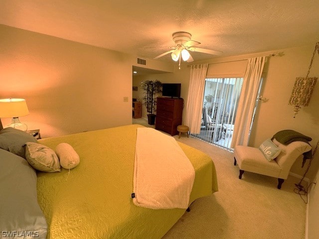 carpeted bedroom featuring access to outside and ceiling fan