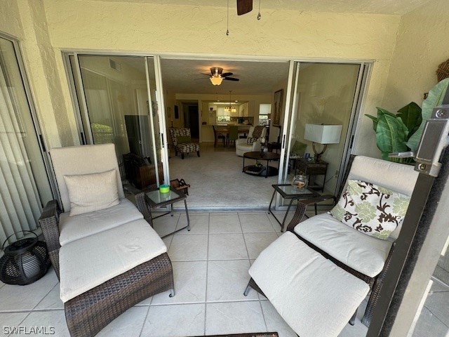 sunroom / solarium with ceiling fan