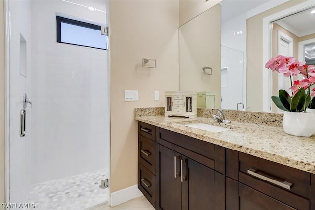 bathroom with vanity and an enclosed shower