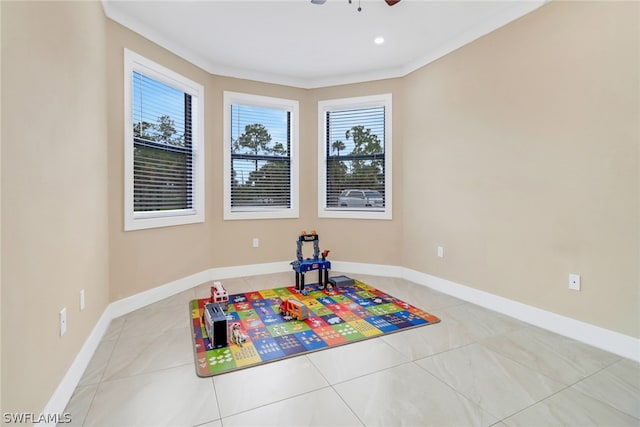 game room with light tile patterned floors and ceiling fan