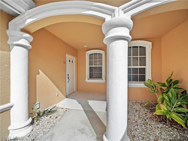 property entrance with a patio area