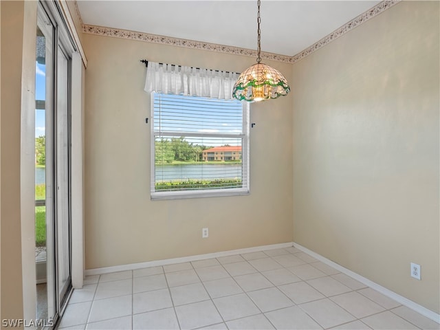 tiled empty room featuring plenty of natural light