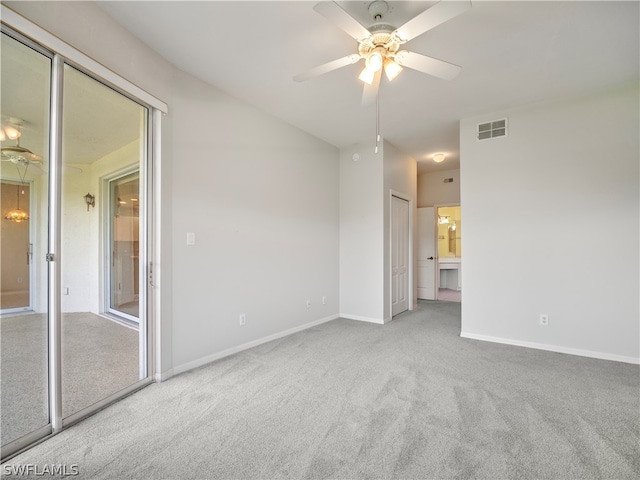 spare room featuring carpet flooring and ceiling fan