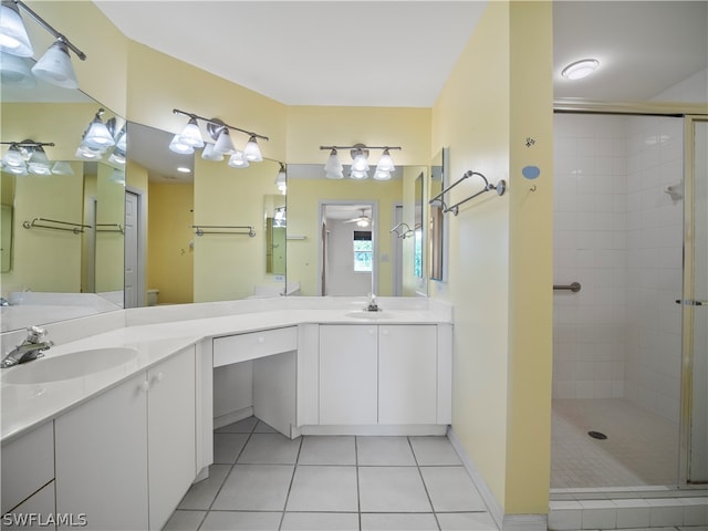 bathroom featuring tile patterned flooring, an enclosed shower, and dual bowl vanity