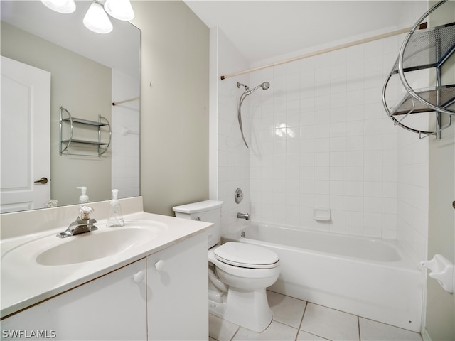 full bathroom featuring vanity, tiled shower / bath combo, toilet, and tile patterned floors