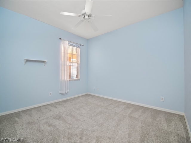 spare room with carpet flooring and ceiling fan