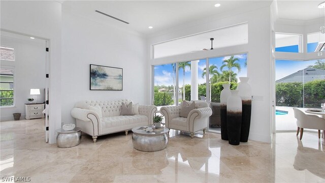 living room featuring crown molding