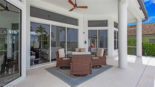 view of patio featuring ceiling fan