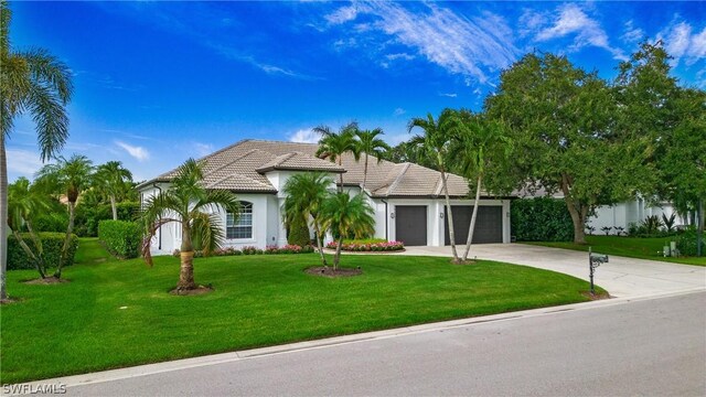 view of front facade featuring a front yard and a garage