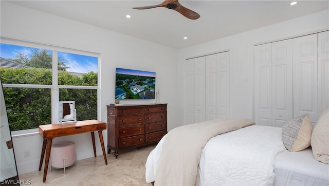 bedroom featuring two closets and ceiling fan