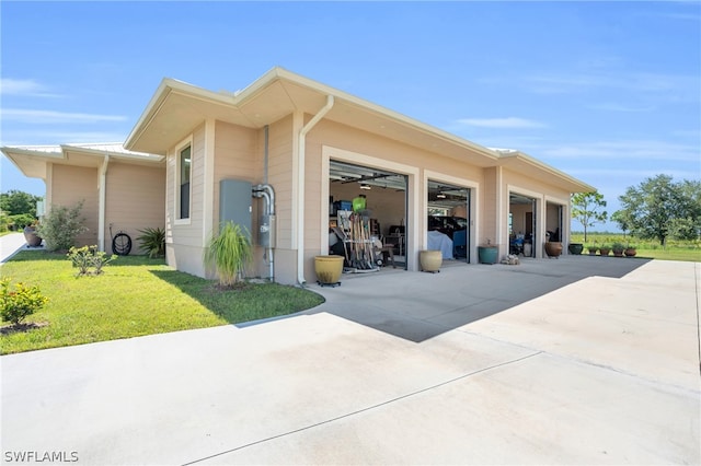 view of side of property with a lawn