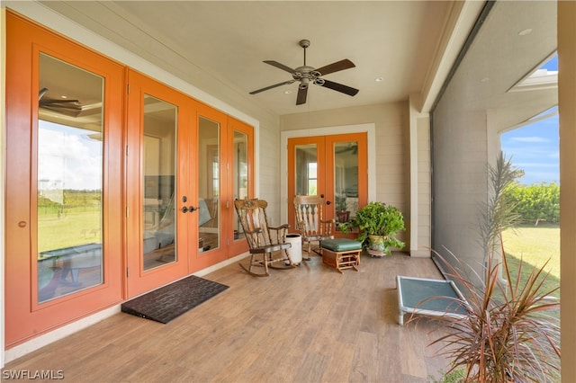 sunroom with french doors, ceiling fan, and plenty of natural light