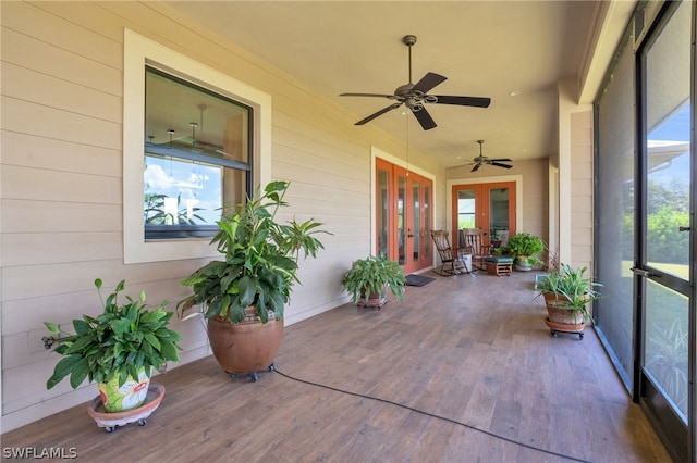 sunroom / solarium with french doors, ceiling fan, and plenty of natural light