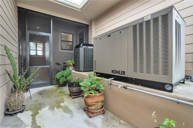 doorway to property featuring central AC unit