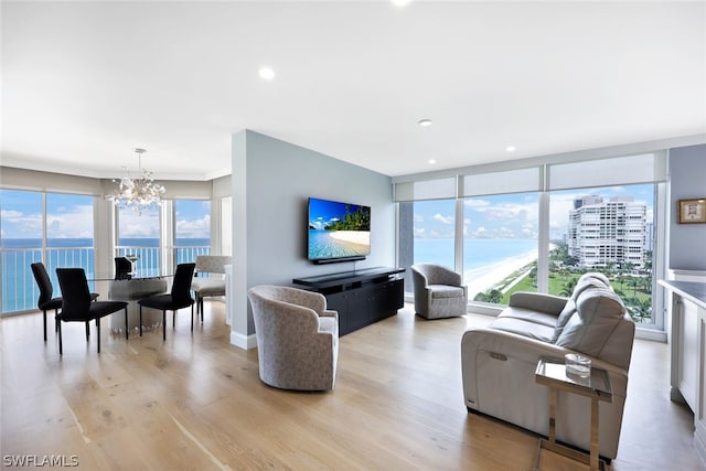 living room featuring a chandelier and light hardwood / wood-style floors