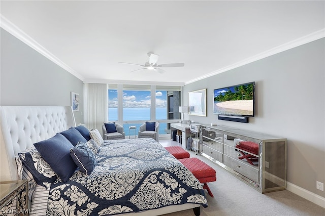 bedroom featuring ceiling fan, ornamental molding, and carpet flooring