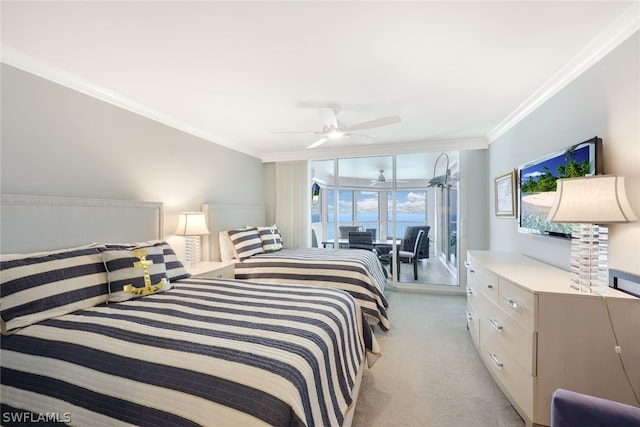 carpeted bedroom featuring access to outside, ceiling fan, crown molding, and multiple windows