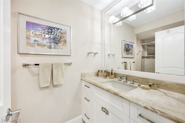 bathroom featuring an enclosed shower and vanity