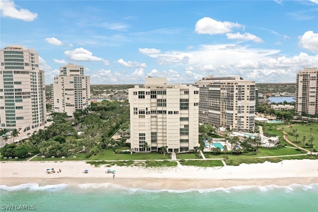 view of property featuring a water view and a view of the beach