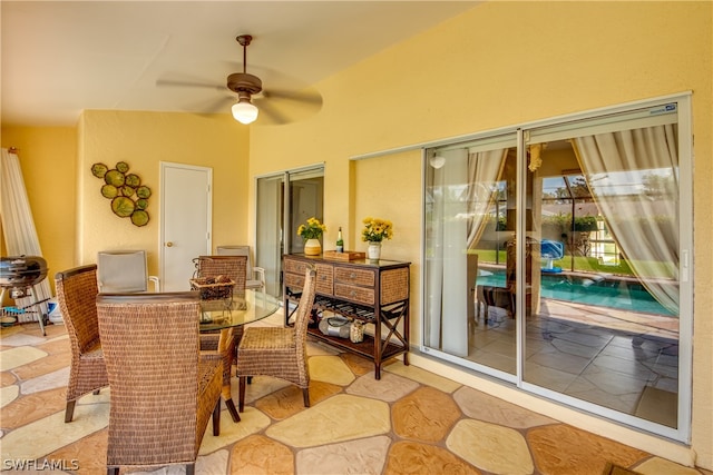 exterior space featuring ceiling fan and lofted ceiling