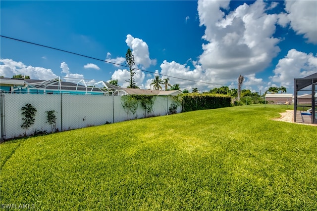 view of yard with a lanai